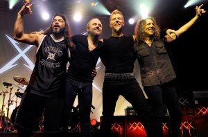 SAN FRANCISCO, CA - DECEMBER 10: (L - R) Robert Trujillo, Lars Ulrich, James Hetfield, and Kirk Hammett bid the crowd farewell at Day Four of the Metallica 30th Anniversary shows at The Fillmore on December 10, 2011 in San Francisco, California. (Photo by Tim Mosenfelder/WireImage)